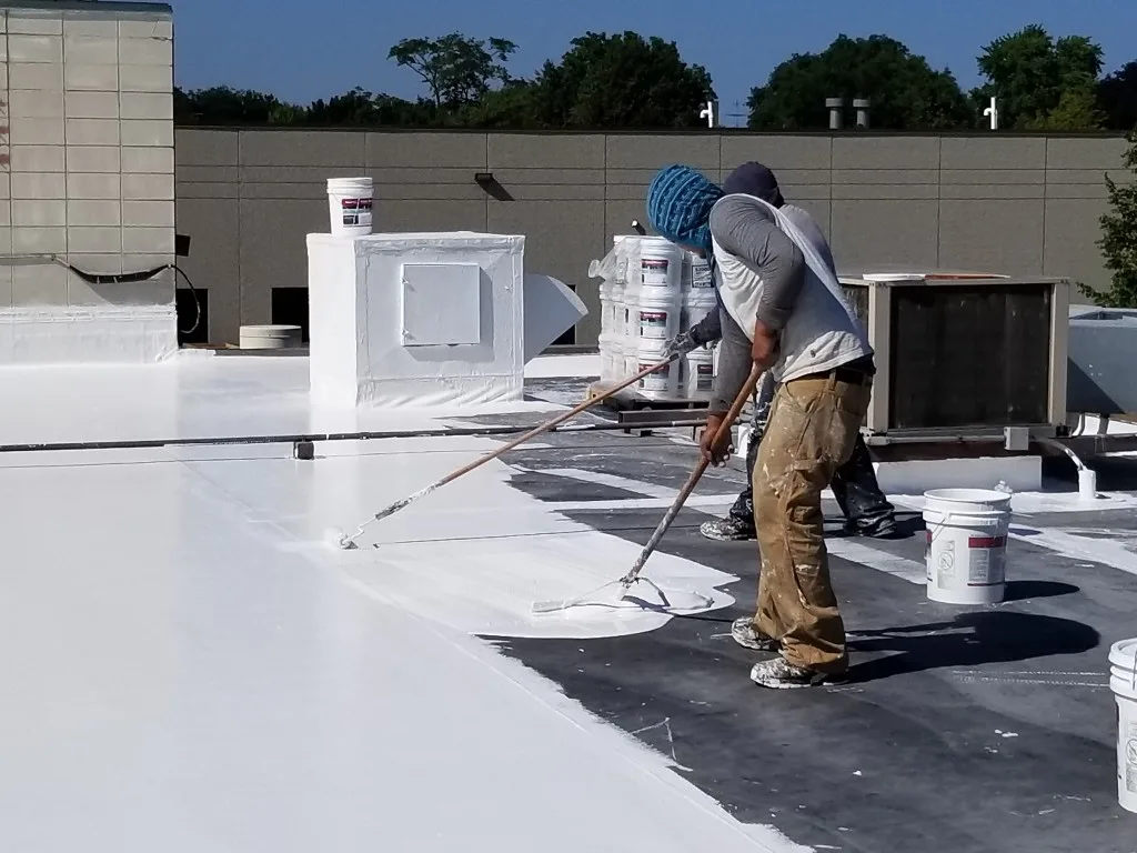 two men working on silicone roof