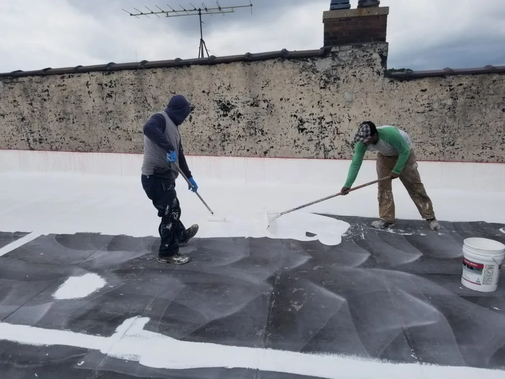 two men working on GacoFlex roof