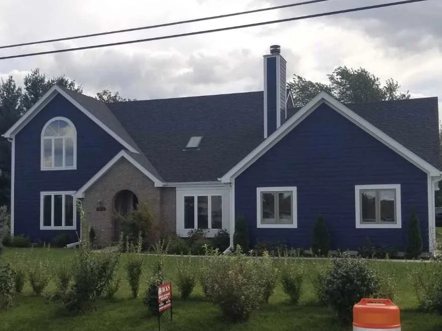 new roof on blue house.