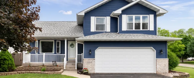 Exterior Of A Blue Suburban Home.